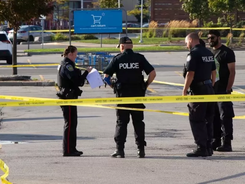  Police officers are seen at the scene investigating on the double shootings in Mississauga, the Greater Toronto Area, Canada, on Sept. 12, 2022. 